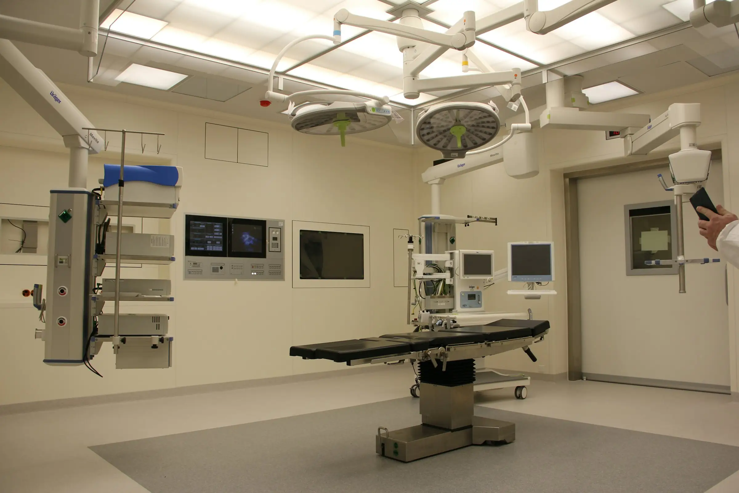 Hospital operating room with a surgical table, lights and medical equipment